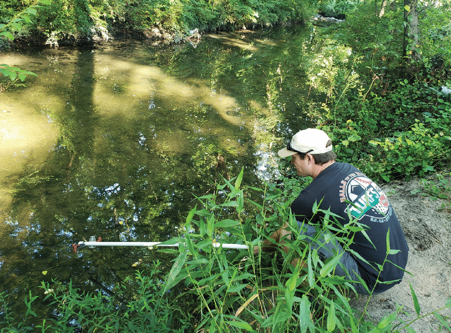 Volunteer conducting a biological assessment of Jordan's Branch VA