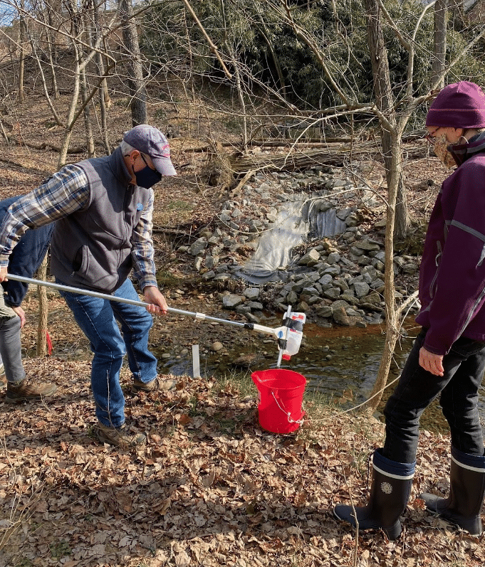 Volunteers collecting water samples at Taylor Run in VA